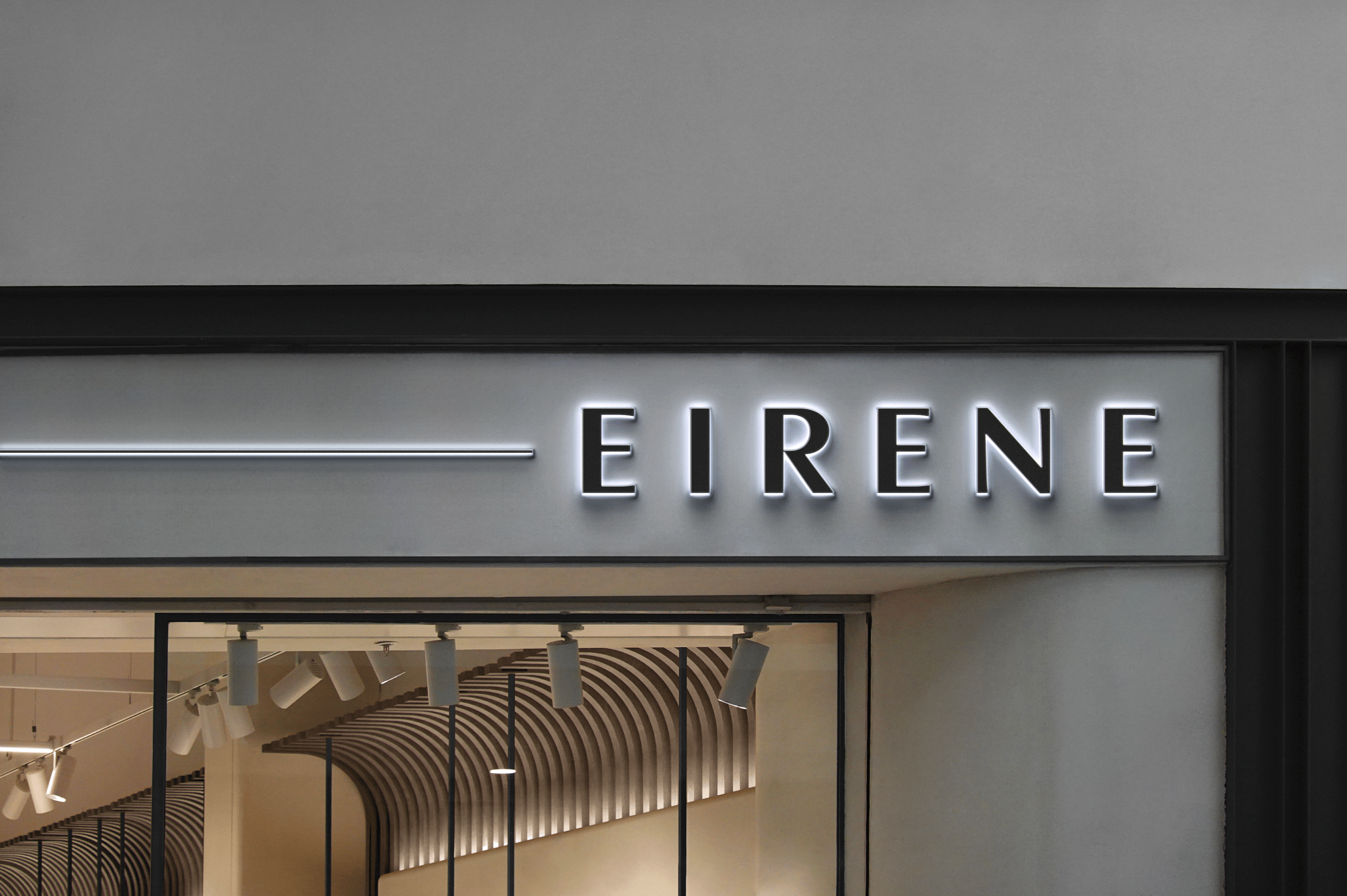 Graphic of a typography specimen showing the alphabet and numerals on top of a dark gray background.