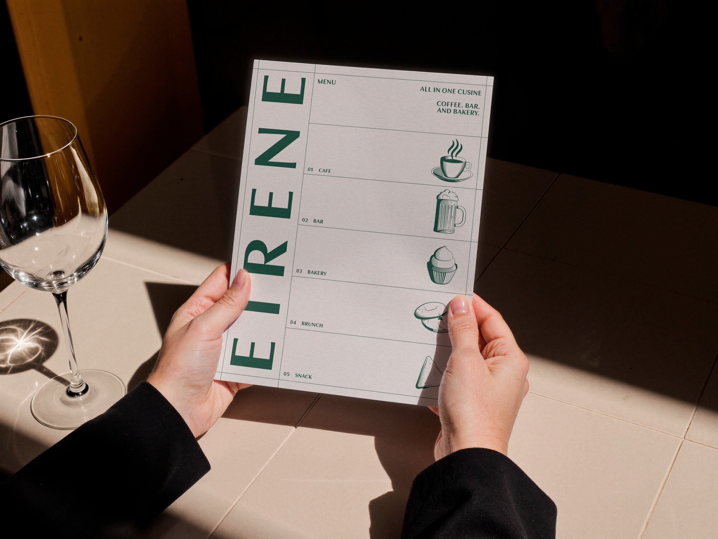 Graphic of a typography specimen showing the alphabet and numerals on top of a dark gray background.