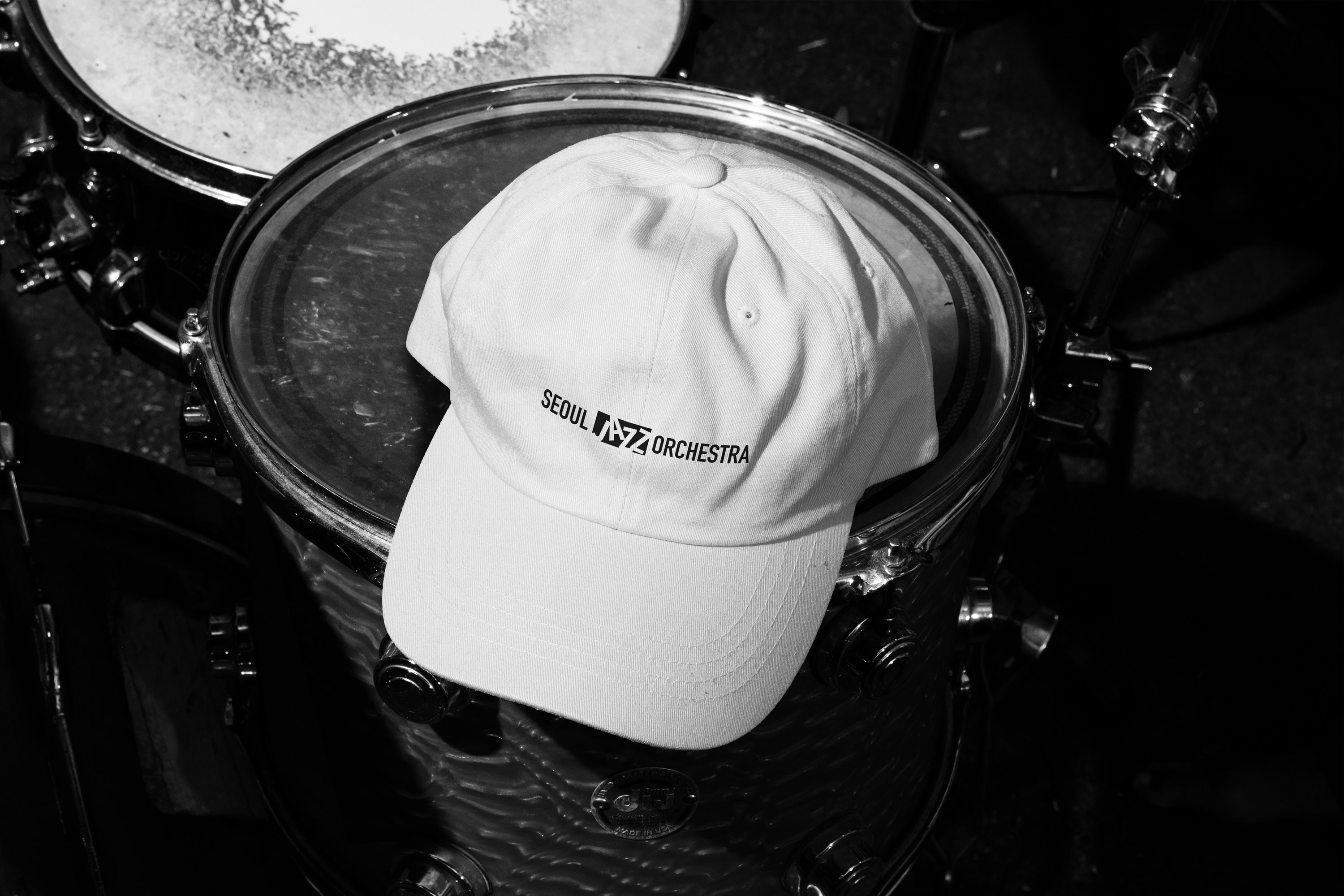 Graphic of a typography specimen showing the alphabet and numerals on top of a dark gray background.